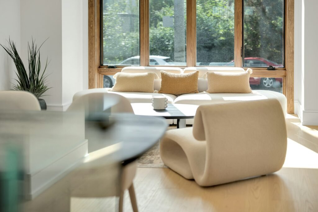 Modern living room with stylish furniture and large window